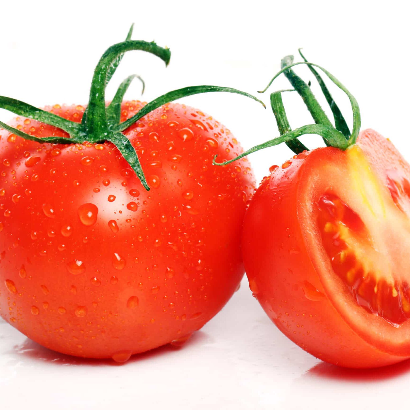 Fresh and tasty tomatoes over white background